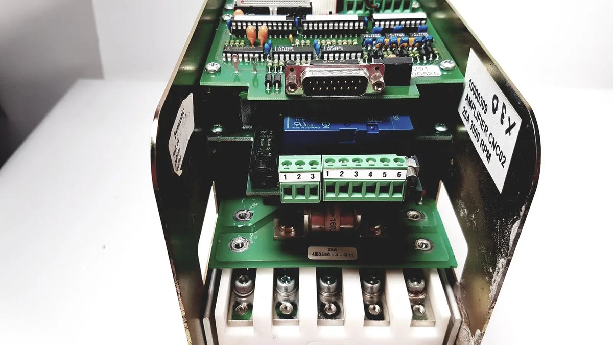 Green circuit board with electronic components inside metallic housing of bystronic amplifier cno2 25a 3000 rpm