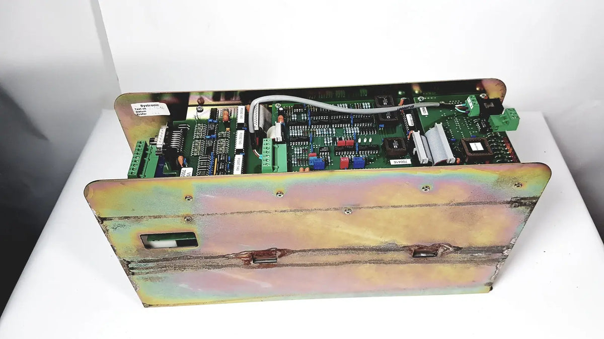 Industrial-grade green circuit board amplifier cno2 25a housed in weathered iridescent metal enclosure with mounting hardware