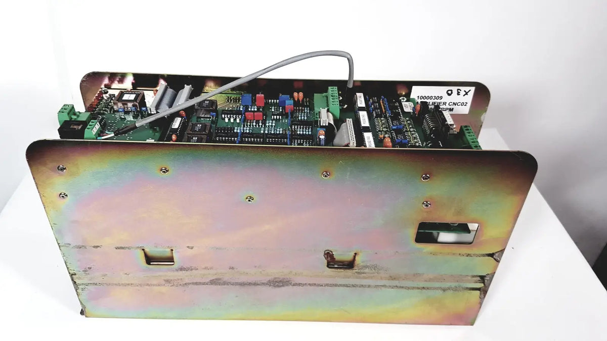 Industrial-grade metal enclosure housing a green circuit board with electronic components in bystronic amplifier cno2 25a