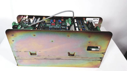 Industrial-grade metal enclosure housing a green circuit board with electronic components in bystronic amplifier cno2 25a
