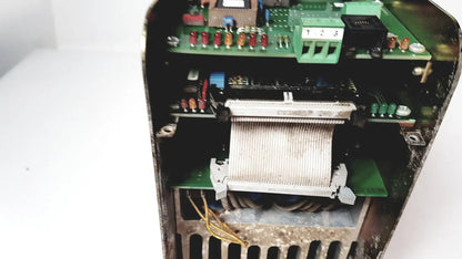 Internal components of a black bystronic amplifier cno2 25a featuring green circuit boards with red capacitors and yellow wiring