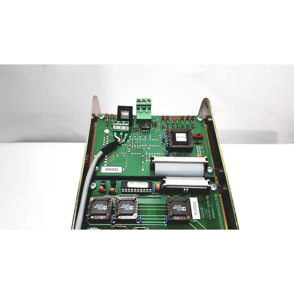 Green printed circuit board of bystronic amplifier cnco2 50a with black integrated circuits silver connectors and gray cable