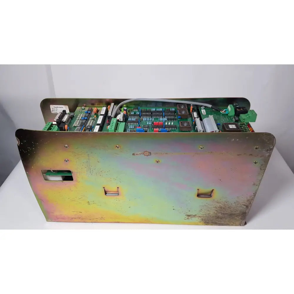 Weathered metallic enclosure housing green circuit board with connectors for bystronic amplifier cnco2 50a reuse medical