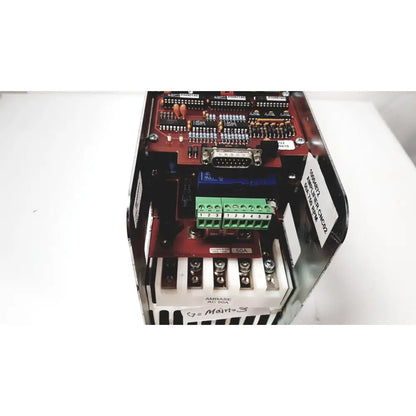 Red circuit board with green terminal blocks and serial port in black metal enclosure of bystronic amplifier cnc02 50a