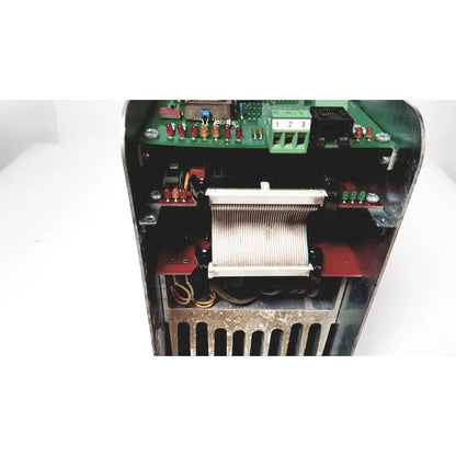 Open-faced bystronic amplifier cnc02 50a with green circuit board red and beige components in metallic housing