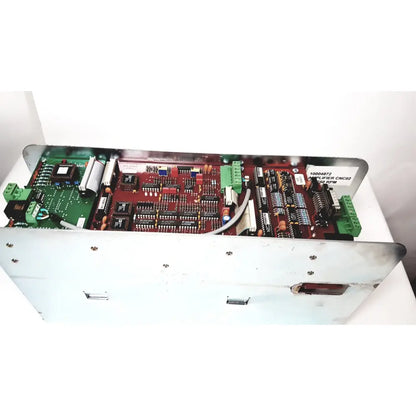 Red and green circuit board assembly housing the bystronic amplifier cnc02 50a in a white metal enclosure