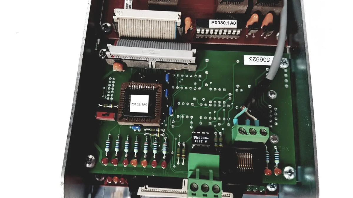 Green printed circuit board of bystronic amplifier cnc02 50a with central chip resistors capacitors and connectors