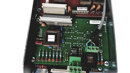Green printed circuit board of bystronic amplifier cnc02 50a with central chip resistors capacitors and connectors