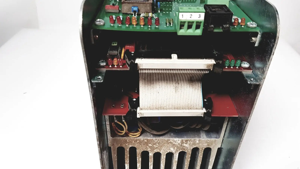 Open-faced bystronic amplifier cnc02 50a with green circuit board red and beige components in metallic housing