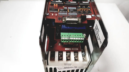 Red circuit board with green terminal blocks and serial port in black metal enclosure of bystronic amplifier cnc02 50a