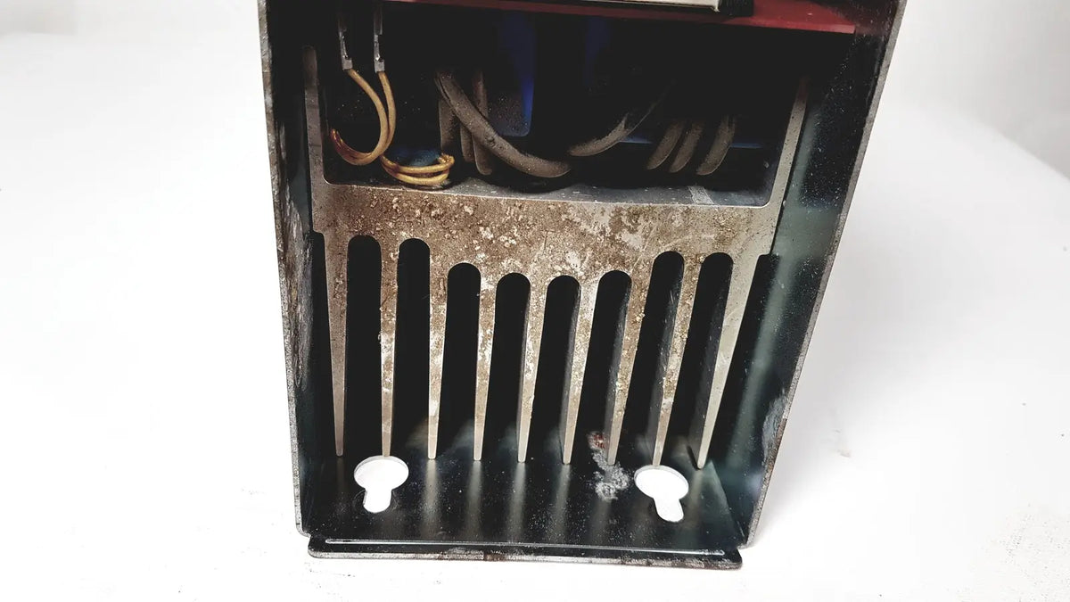 Rusty black metal heat exchanger with vertical fins and coiled wires inside for bystronic amplifier cnc02 50a product