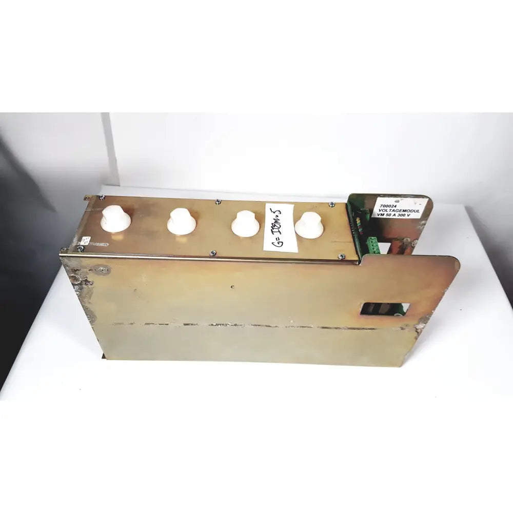 Brass-colored metal module vm 50a with four white knobs and green circuit board for 50a 300v power supply by bystronic