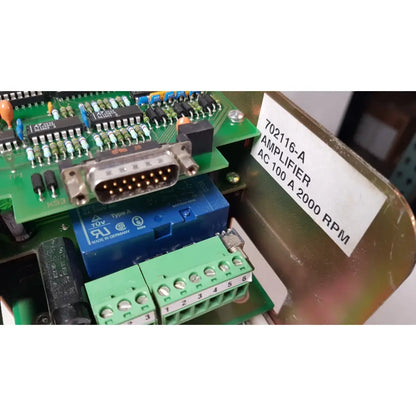 Blue relay switch with green terminal blocks and silver d-sub connector on circuit board of bystronic 702116-a amplifier