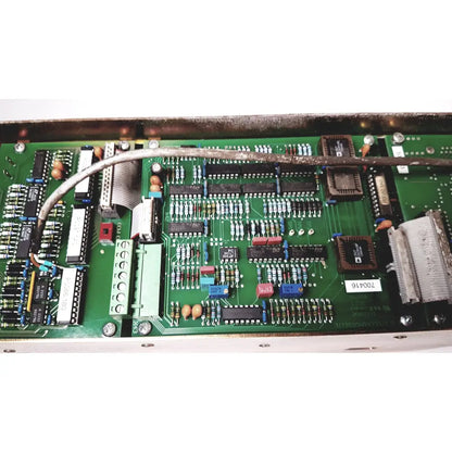 Green printed circuit board with electronic components and silver cable of bystronic 702116-a amplifier ac 100 a 2000 rpm