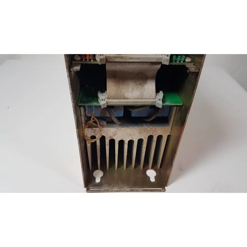 Rusty metal bystronic 702116-a amplifier power supply with visible internal components and heat sink