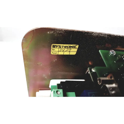 Black metal casing of bystronic 702116-a amplifier with yellow bystronic label and serial number 9429