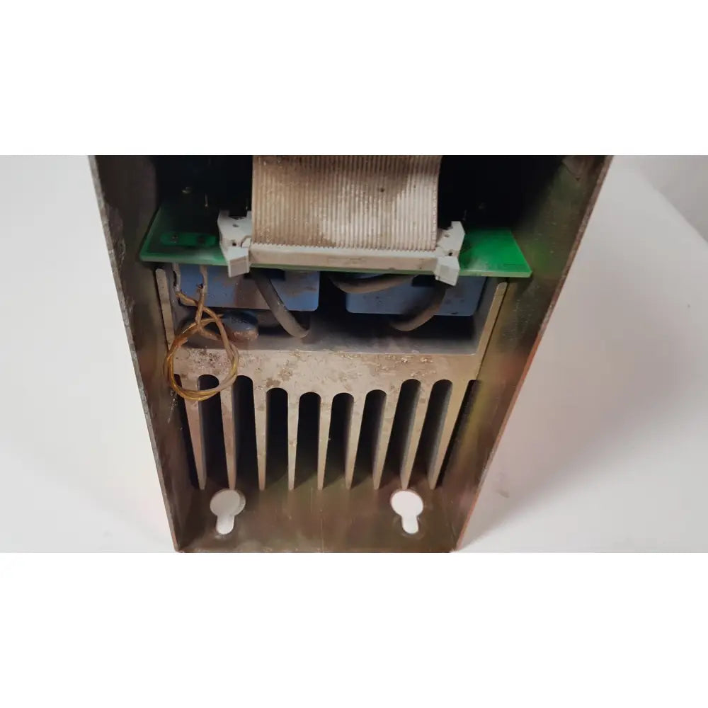 Weathered metallic bystronic 702116-a amplifier ac 100 a 2000 rpm with ribbed heat sink and internal circuitry visible
