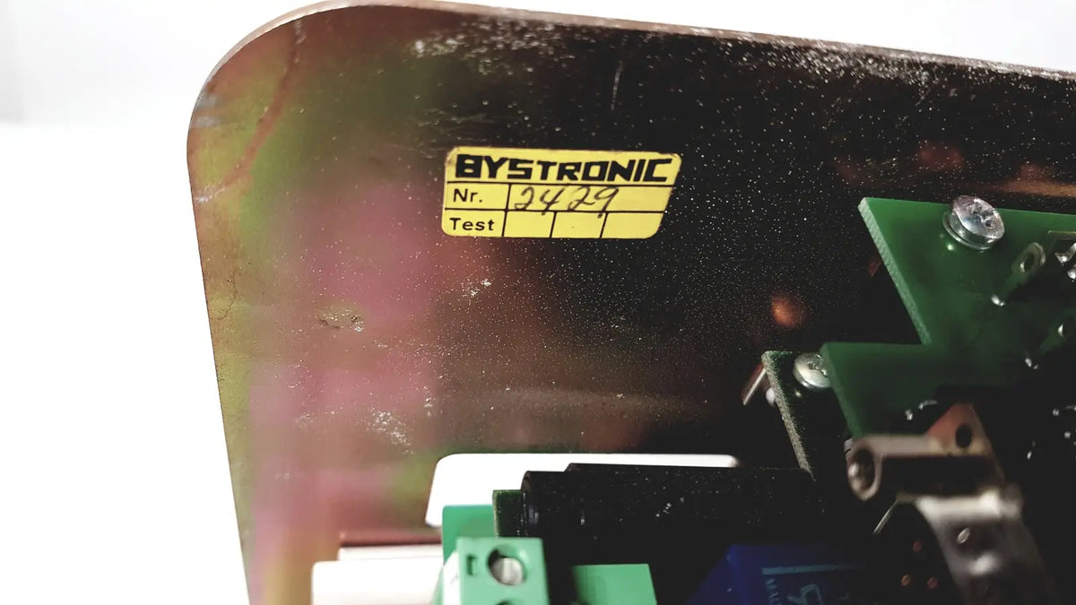 Black metal casing of bystronic 702116-a amplifier with yellow bystronic label and serial number 9429