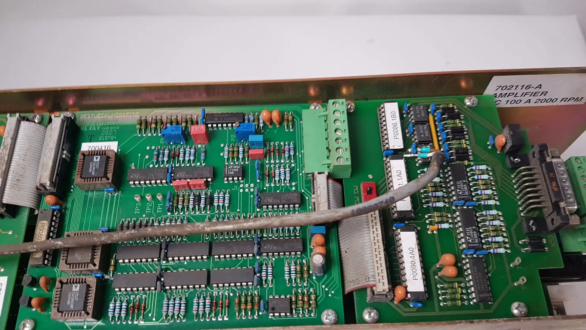 Green circuit board of bystronic 702116-a amplifier with label indicating ac 100 a 2000 rpm for industrial use