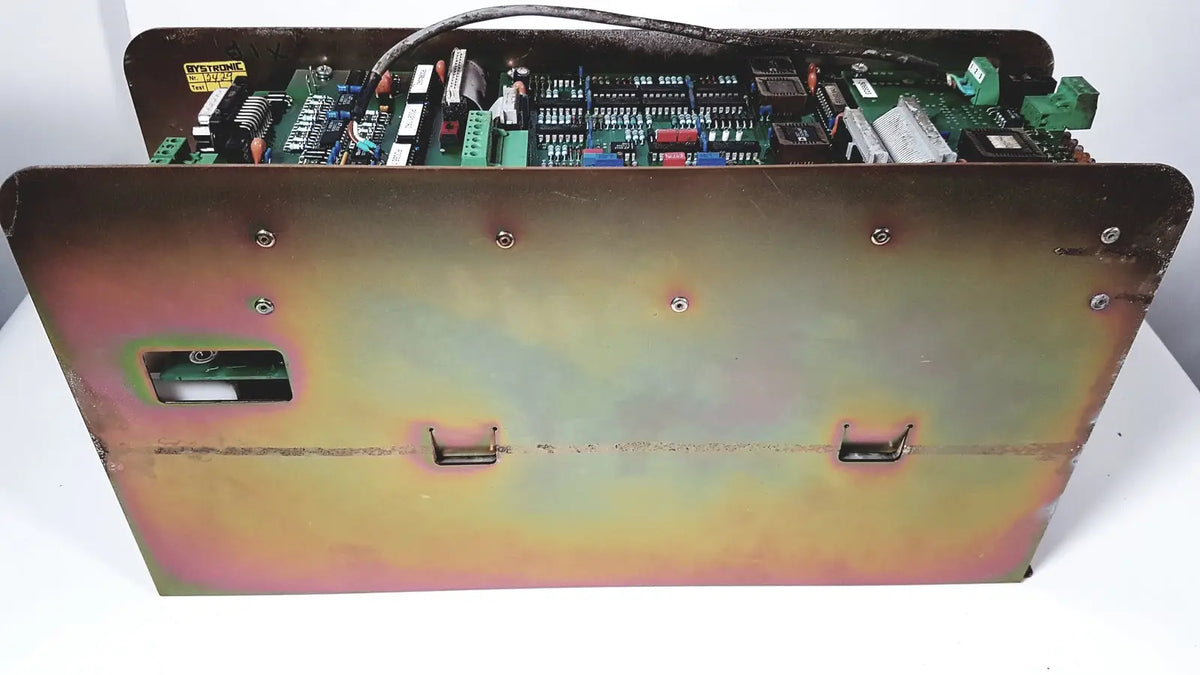 Industrial-grade metal enclosure of bystronic 702116-a amplifier with weathered iridescent finish and visible internal circuitry