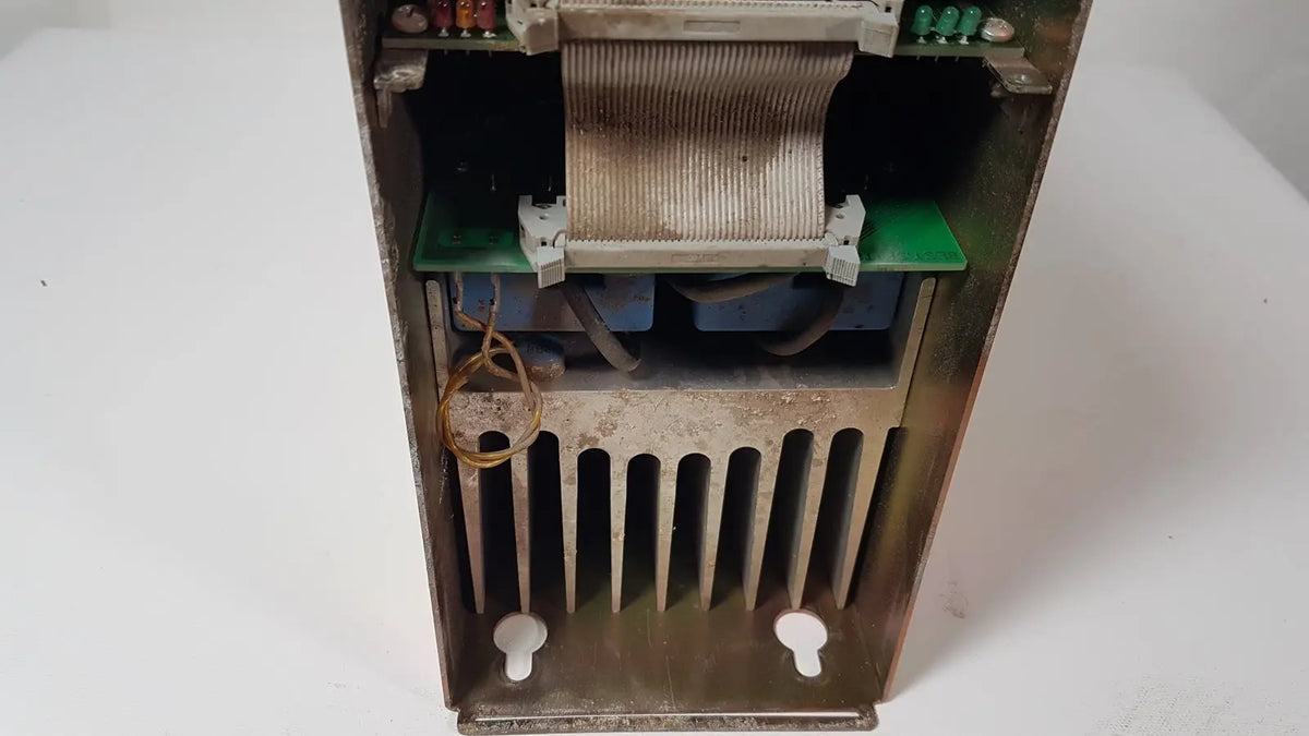 Rusty metal bystronic 702116-a amplifier power supply with visible internal components and heat sink