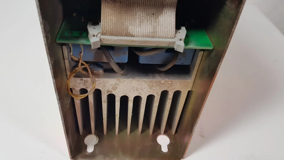 Weathered metallic bystronic 702116-a amplifier ac 100 a 2000 rpm with ribbed heat sink and internal circuitry visible
