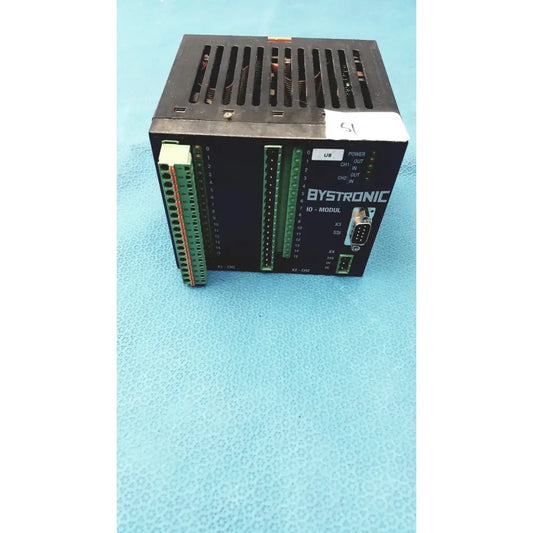 Black bystronic modul input output module showing green terminal blocks and d-sub connector on the back side