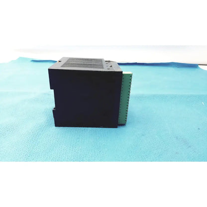 Bystronic black plastic modul input output module with green terminal strip on the side for industrial use