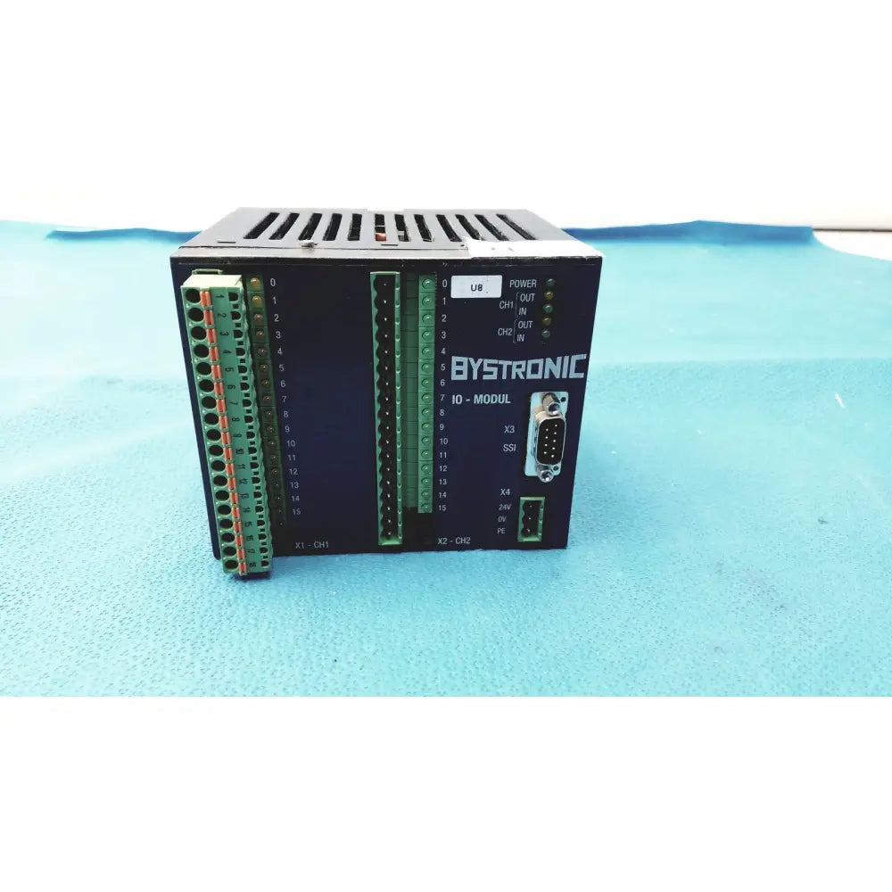 Black bystronic io-modul input output module with green terminal blocks and db9 serial port for industrial control