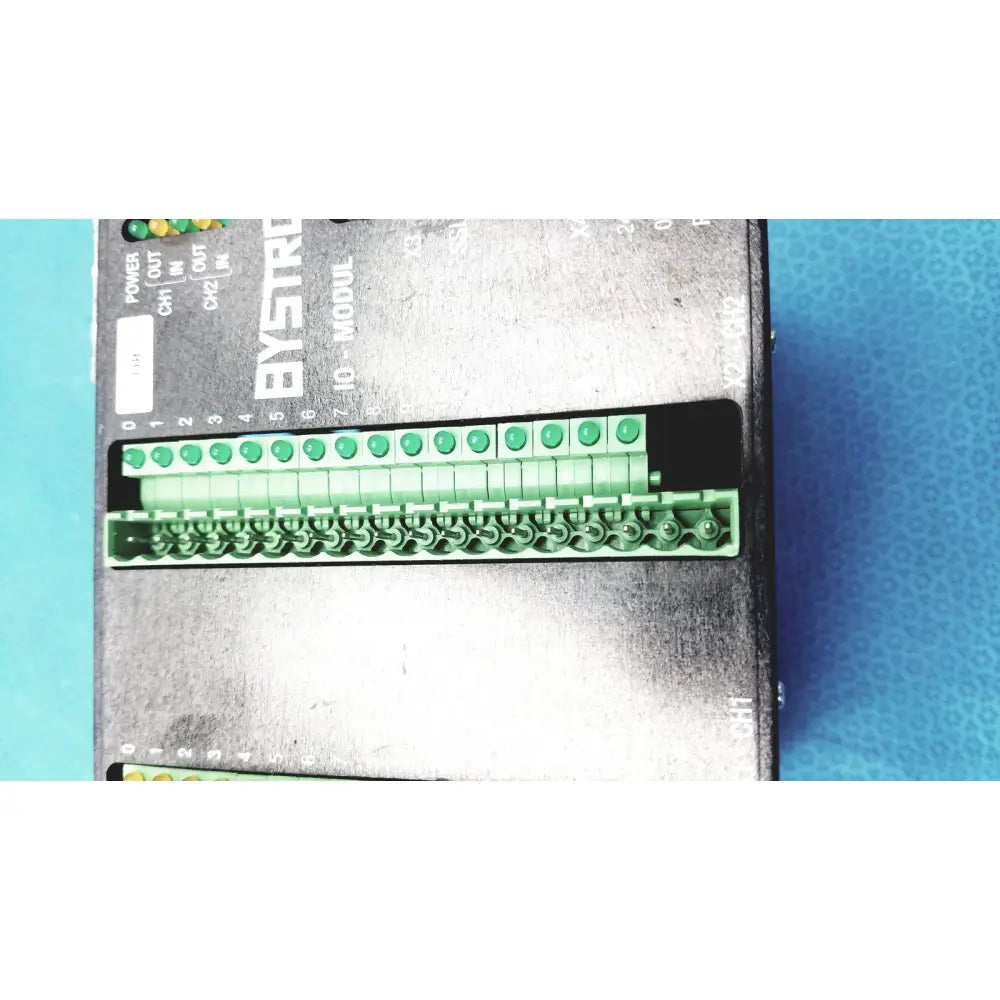 Bystronic modul input output industrial module with black metal casing green terminal blocks and labeled connectors
