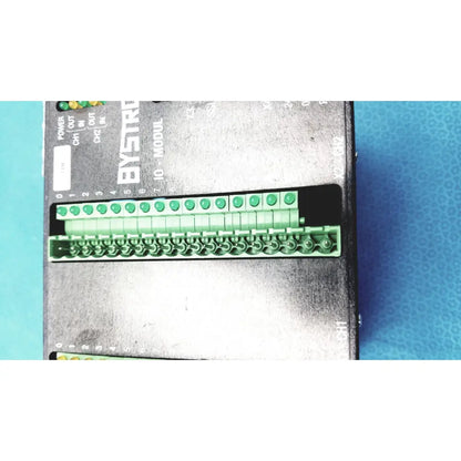Bystronic modul input output industrial module with black metal casing green terminal blocks and labeled connectors