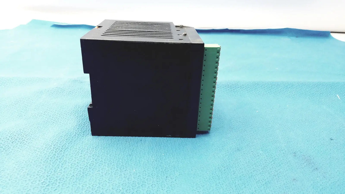 Bystronic black plastic modul input output module with green terminal strip on the side for industrial use