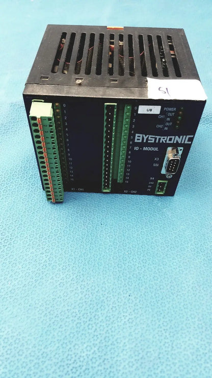 Black bystronic modul input output module showing green terminal blocks and d-sub connector on the back side