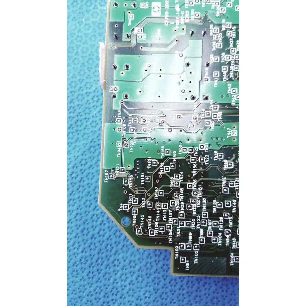 Green carriage pca board c7769-60007 with silver solder joints and black component markings for hp designjet