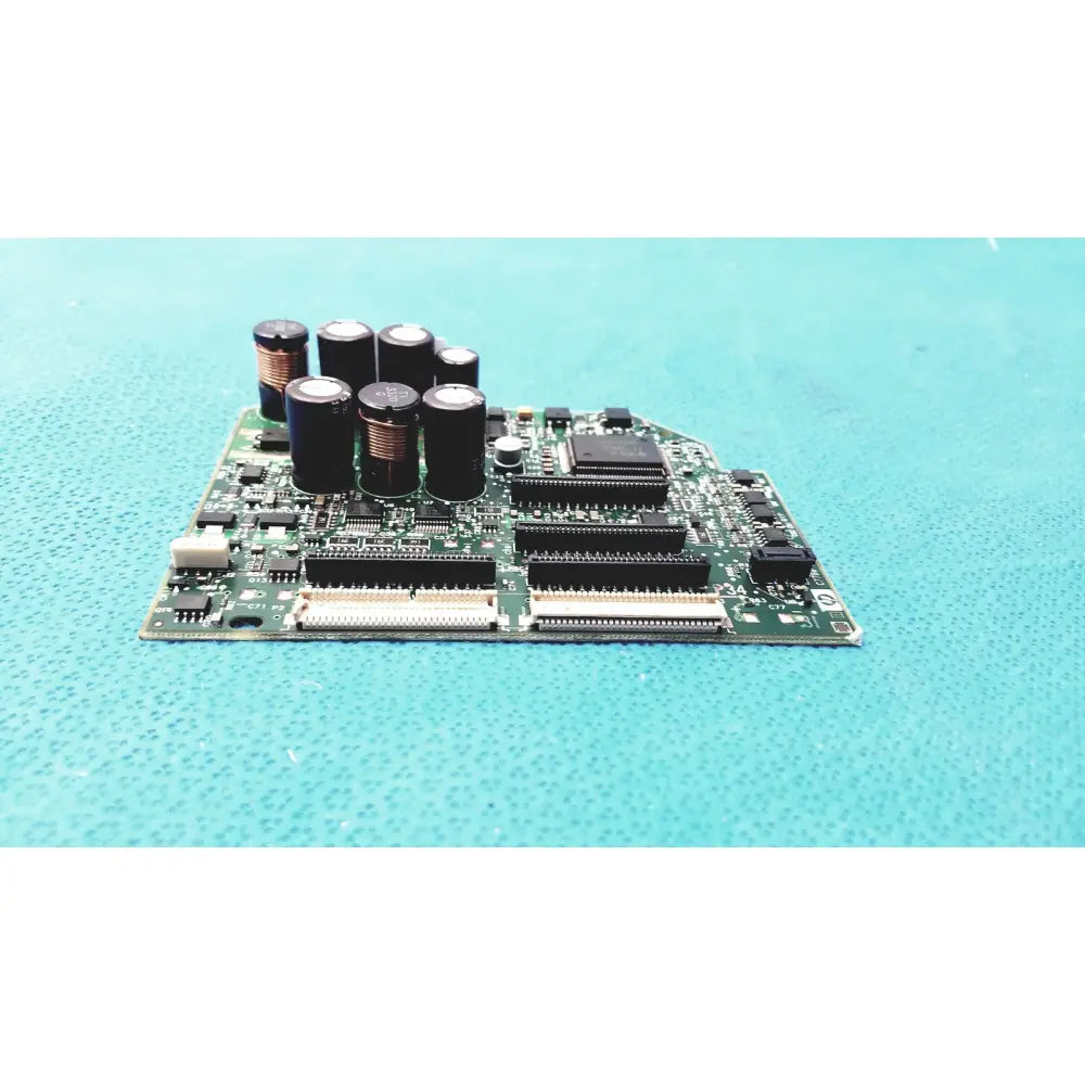 Green circuit board with black capacitors and integrated circuits in c7769-60007 carriage pca board for hp designjet