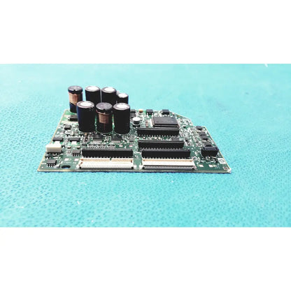 Green circuit board with black capacitors and integrated circuits in c7769-60007 carriage pca board for hp designjet