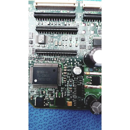 Green printed circuit board with black integrated circuits capacitors and connectors for c7769-60007 carriage pca board