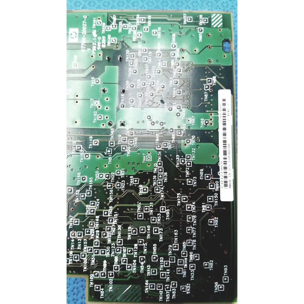 Green carriage pca board c7769-60007 with black solder pads silver traces and white barcode label for hp designjet