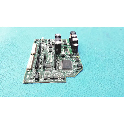 Green printed circuit board with black capacitors and integrated circuits for c7769-60007 carriage pca board