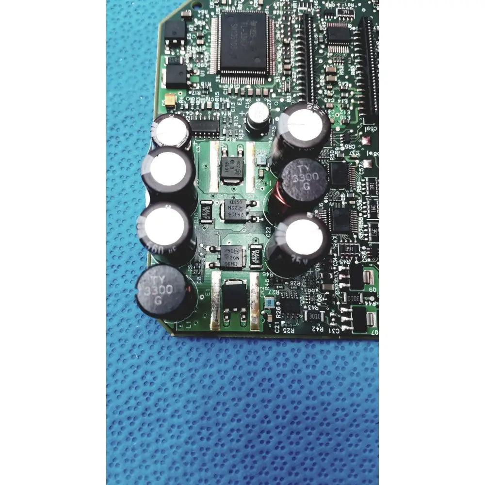 Green circuit board with black capacitors and integrated circuits of c7769-60007 carriage pca board for hp designjet
