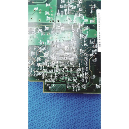Green printed circuit board with silver soldered traces and labeled component footprints for c7769-60007 carriage pca board