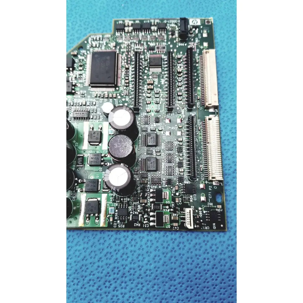 Green carriage pca board c7769-60007 with black integrated circuits and capacitors for hp designjet printers