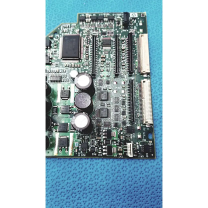 Green carriage pca board c7769-60007 with black integrated circuits and capacitors for hp designjet printers