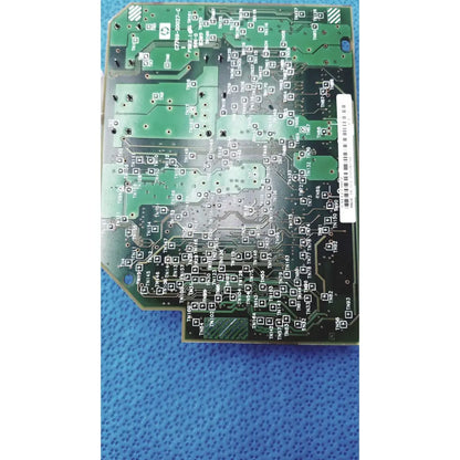 Green printed circuit board with black solder pads and silver traces featuring white barcode label for c7769-60007 carriage pca board