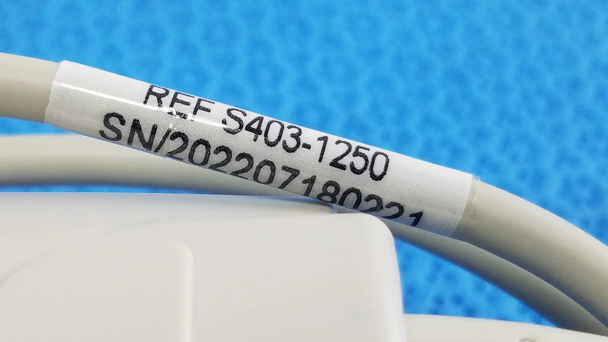 White label with black printed serial number wrapped around beige cable for adult spo2 pulse oximeter s403-1250 sensor