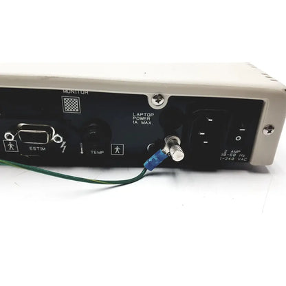 Black cadwell sierra ii wave channels base station with silver edges and green cable connected to rear panel