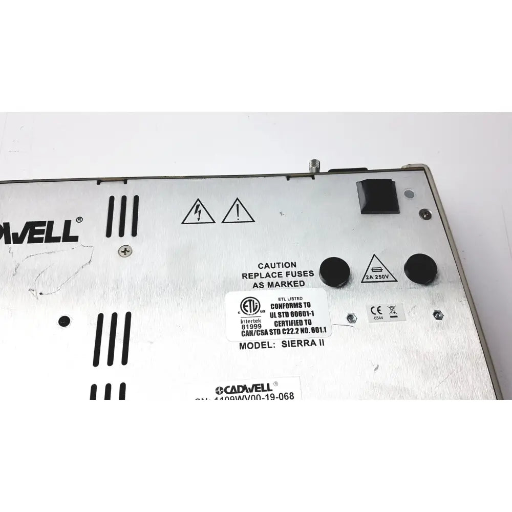 Silver metallic cadwell sierra ii wave channels base station power supply unit with black knobs and warning labels