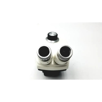 White and black binocular microscope with silver-rimmed eyepieces and central focus knob for cambridge instruments stereozoom