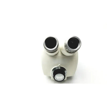 Cream-colored cambridge instruments stereozoom stereo microscope with dual eyepieces and black focus knob with markings