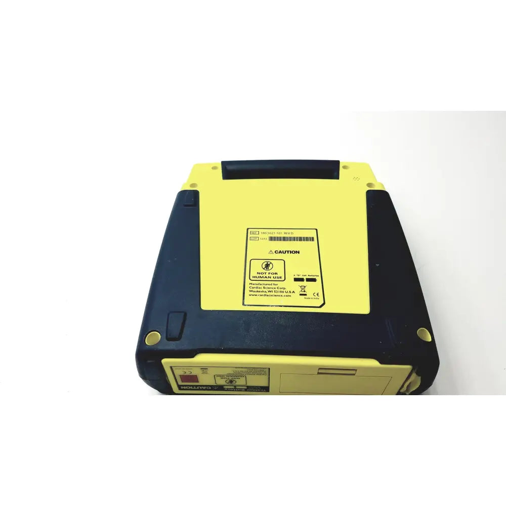 Yellow and black cardiac science aed trainer teaching device with sturdy rectangular design and caution label on back side